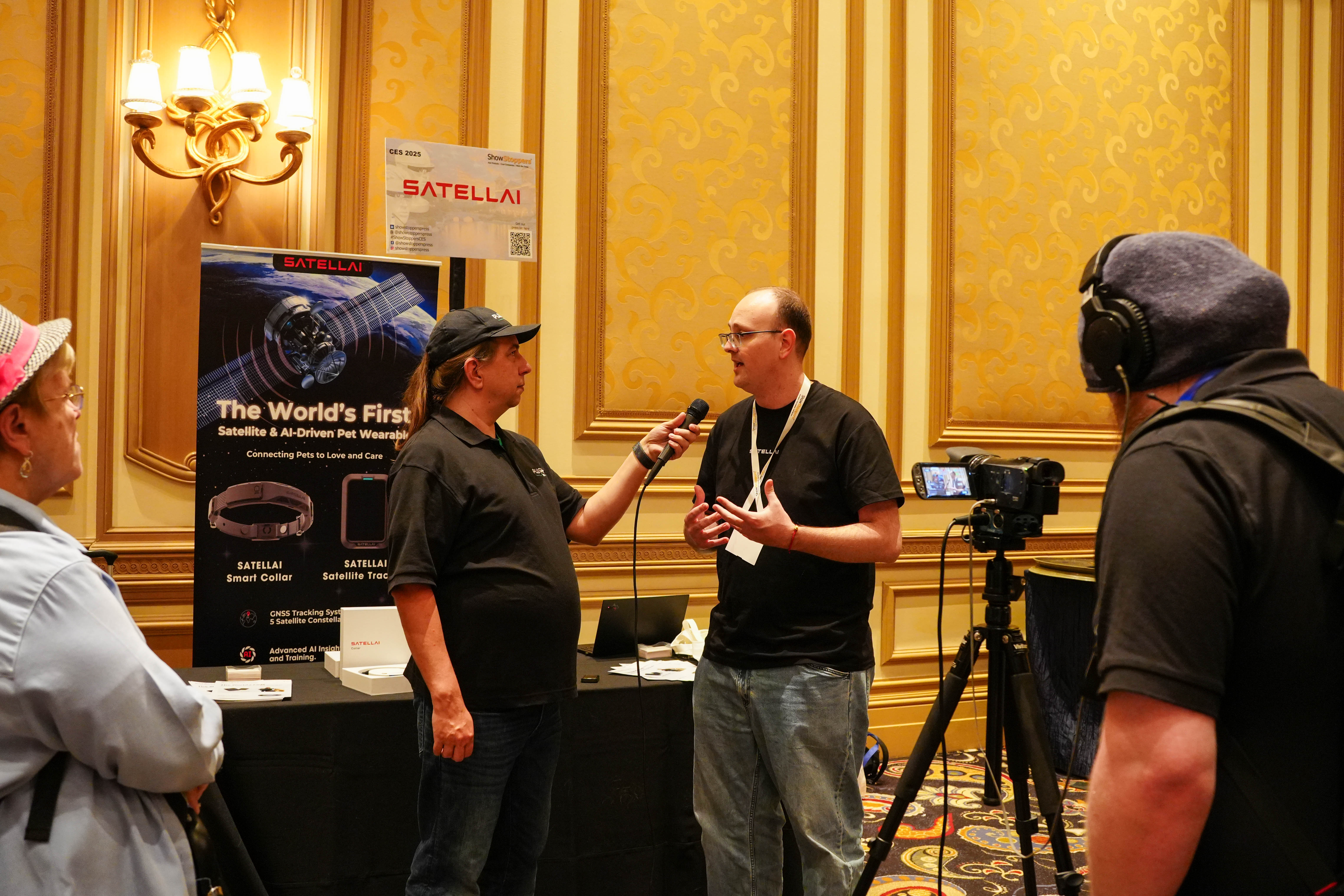 PETVORA team presenting the satellite AI pet wearable at CES 2025.