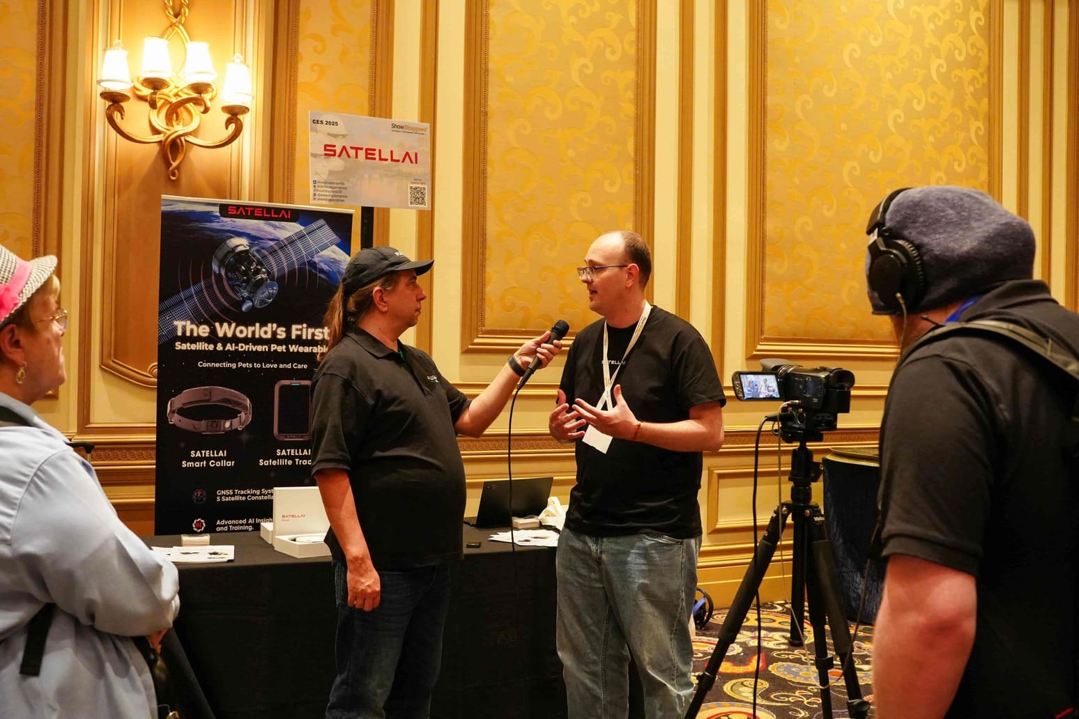 PETVORA team presenting the satellite AI pet wearable at CES 2025.